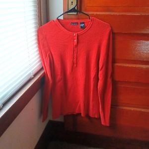 Reddish orange sweater